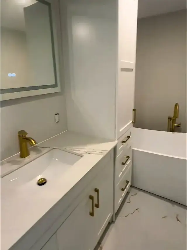 Bathroom vanity with gold fixtures